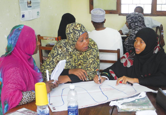 Group work during an action research workshop © EENET 