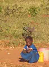 Girls fetching water near a school in Zambia