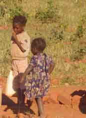 Girls fetching water near a school in Zambia