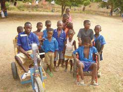 Children help each other with washing clothes