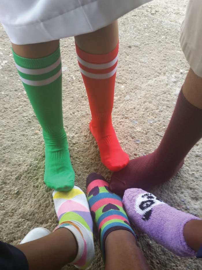 Wearing multi-coloured and mismatched socks for World Down Syndrome Day.