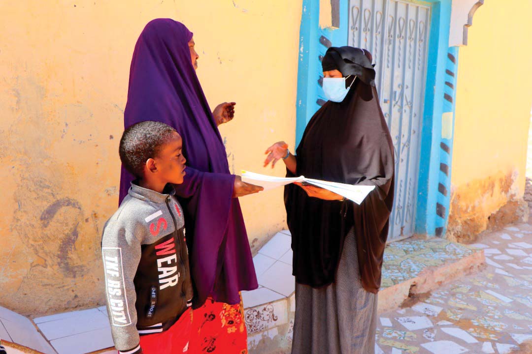 Discussing the home learning booklet in Somalia