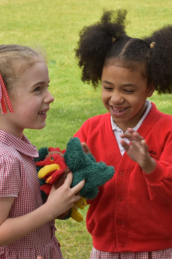Playing with puppets as part of a primary school music class
