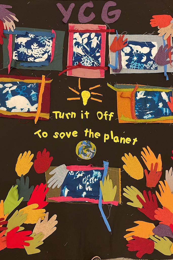 A colorful poster with hands and pictures of the earth.